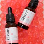 Best vitamin c serum bottles arranged on white background with citrus slices for brighter glowing skin in 2026