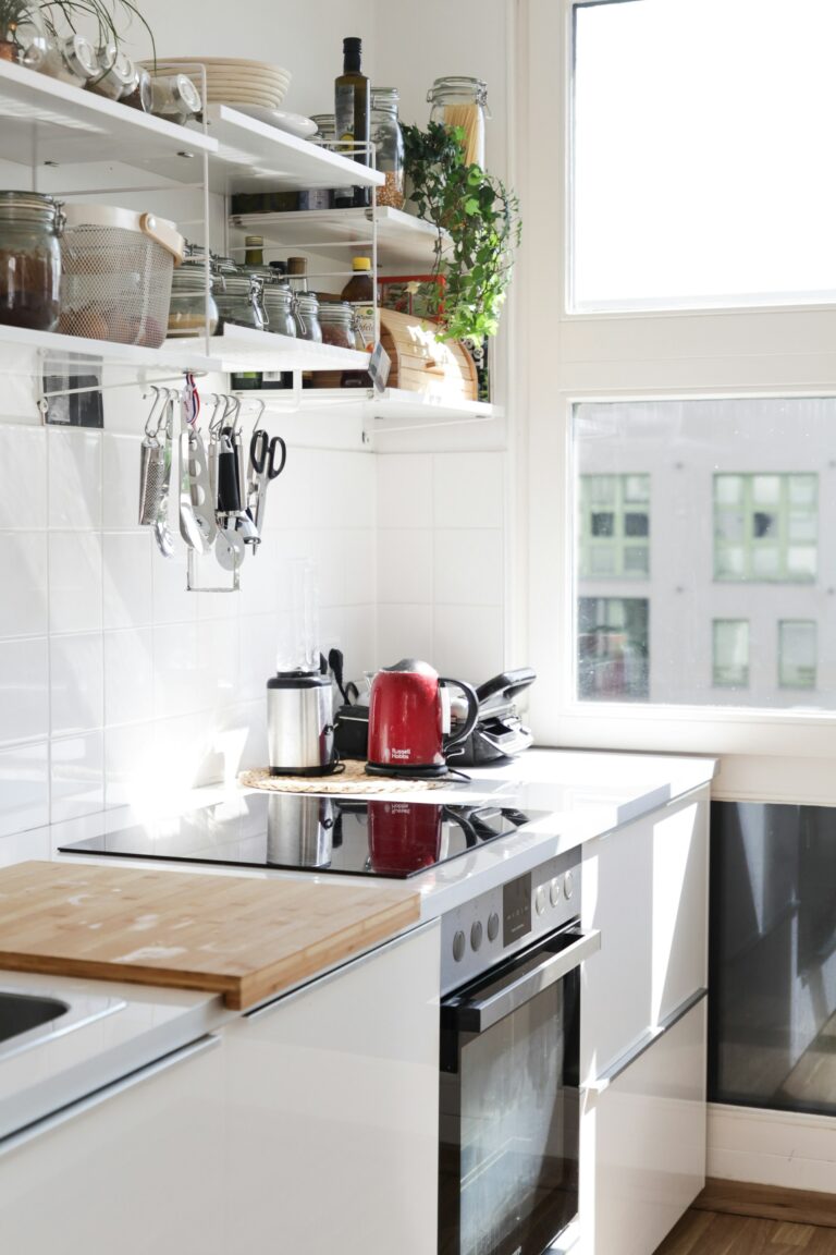 Compact cookware for small apartments arranged neatly on a stovetop in a cozy studio kitchen
